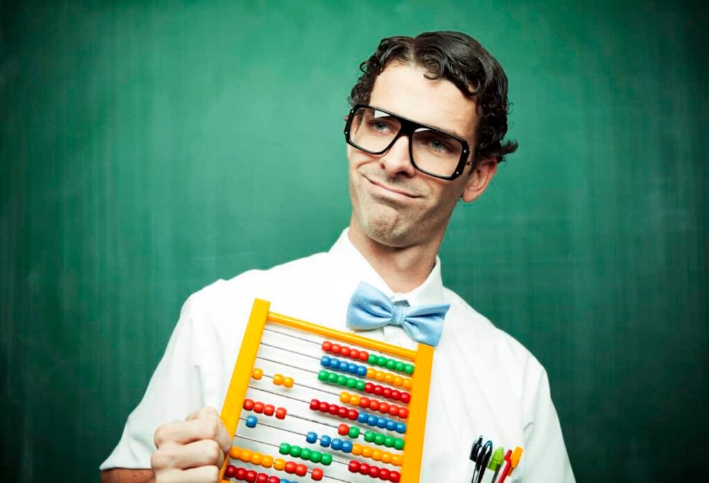 man in bowtie poses with abacus
